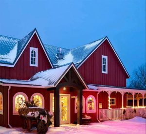 Residential home with icicles hanging from the eavestrough after a snowstorm in London, Ontario, showing early signs of roof ice buildup